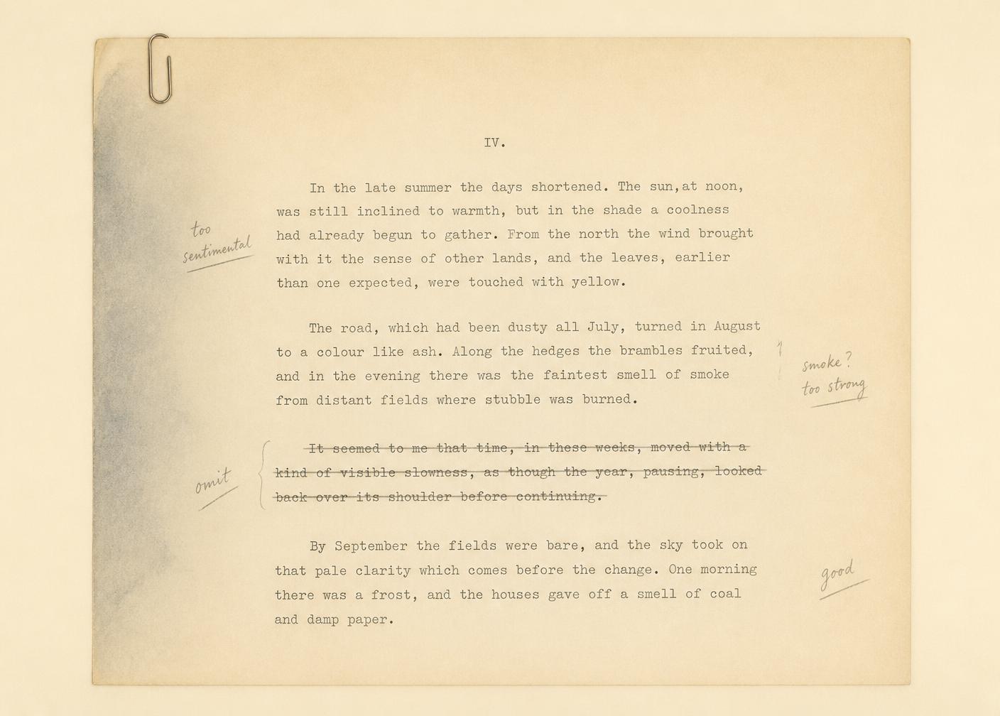 An aged typed manuscript page held by a paperclip, pencil notes in the margin and one paragraph struck through with a single ruled line